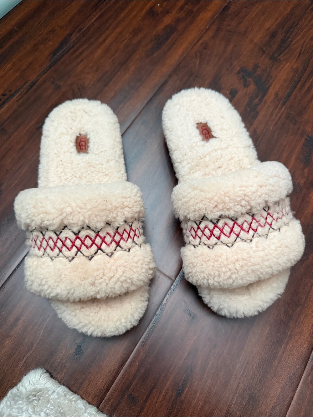 UGG Plush Shearling Slide Slippers in Cream with Red Stitching